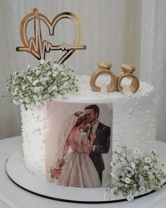 کیک با طرح حلقه و عروس و داماد سالگرد ازدواج 