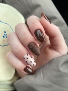 Autumn nail model in brown color