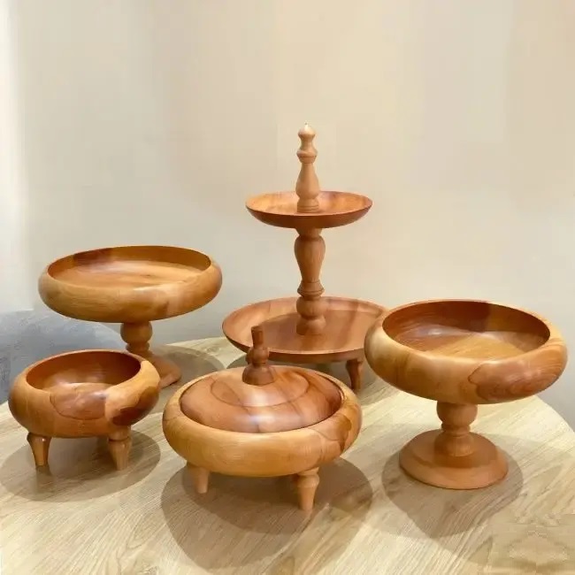 A group of wooden bowls on a tableAI-generated content may be incorrect.