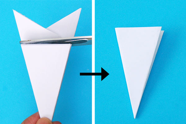 برش اضافات کاغذ برای ساخت کاردستی ساده با کاغذ سفید